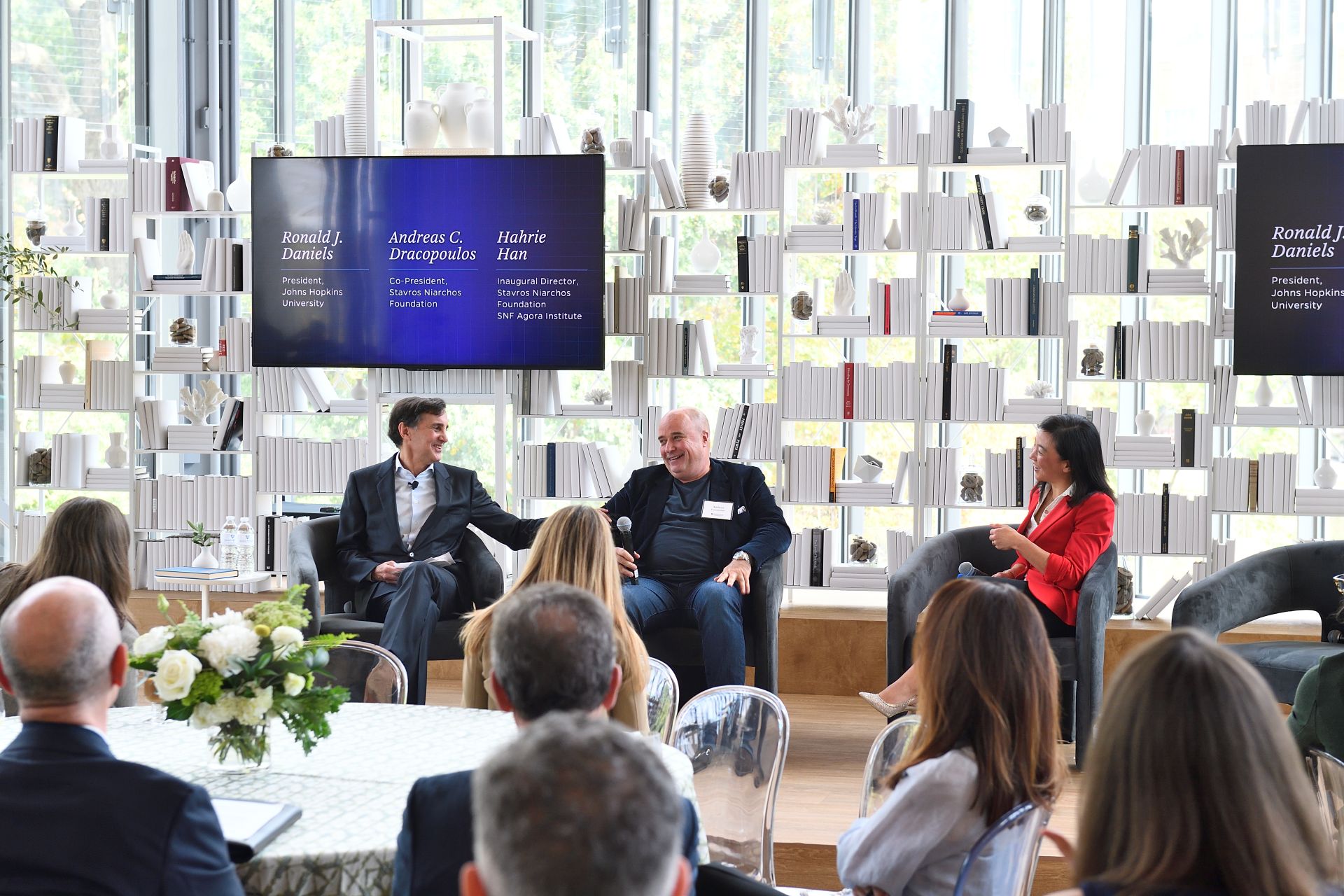 Three persons on a panel discussion at the SNF Agora Institute event. 